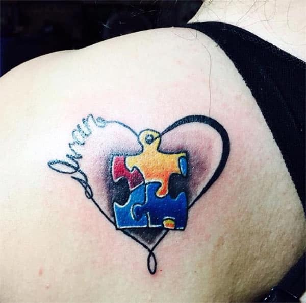 Autism Tattoo on the back shoulder makes a women look attractive