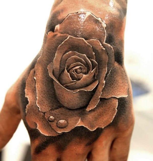 Awesome Tattoo with a brown flower ink design makes a man look elegant