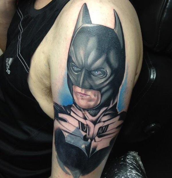Batman tattoo on the upper arm makes a man look foxy