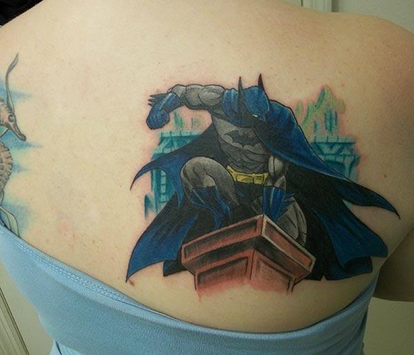 Batman tattoo on the back shoulder makes a women look attractive