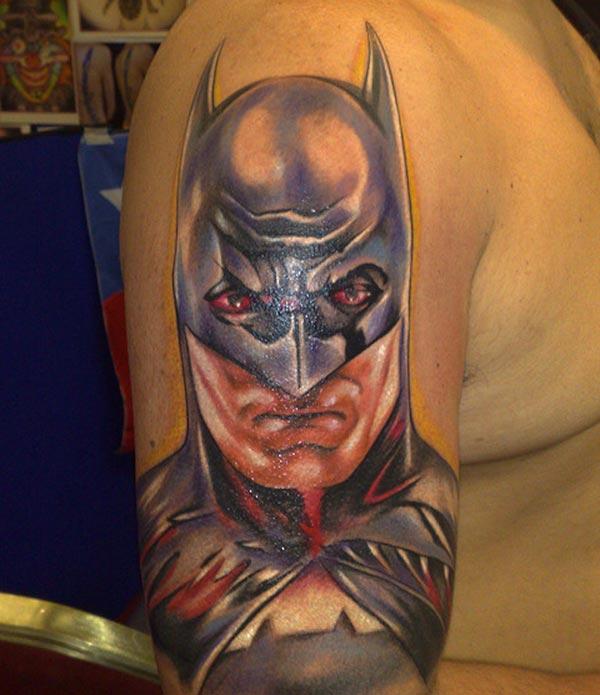 Batman tattoo on the right upper arm brings the spruce appearance in men