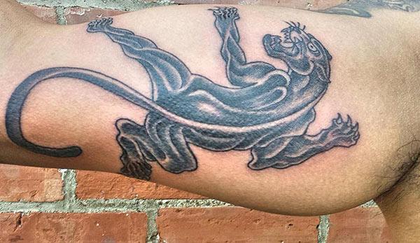 Bicep Tattoo for men with a black tiger ink design make them look ornate