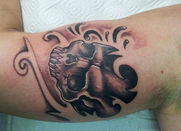 Bicep tattoo for men with a black ink design make a man look cool