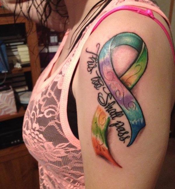 Cancer Ribbon tattoo on the shoulder brings the dispirited look
