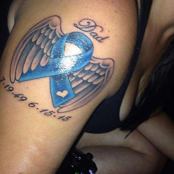Cancer Ribbon tattoo on the shoulder brings the lugubrious look