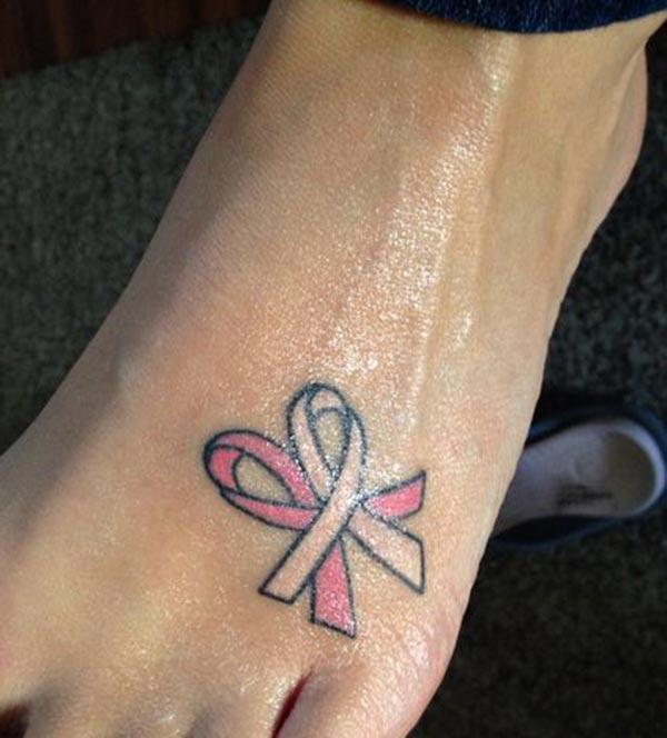 Cancer Ribbon tattoo on the toe makes a women look joyless