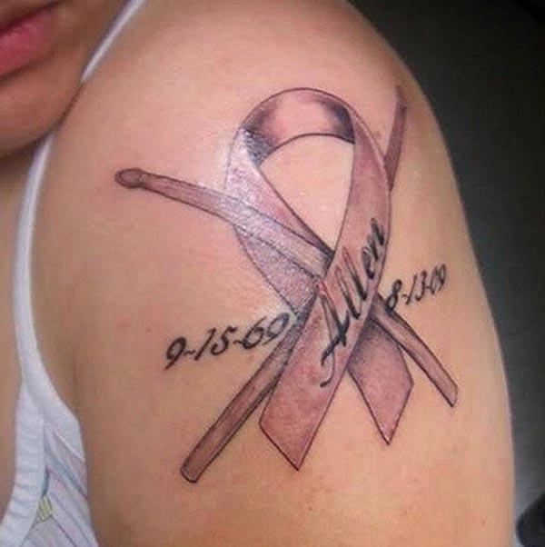Cancer Ribbon tattoo on the shoulder gives the ponderous look