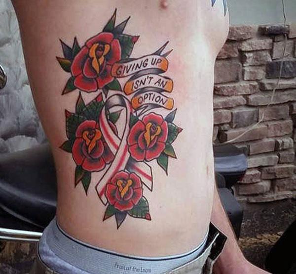Cancer Ribbon tattoo on the side belly with a flower gives the desolate look