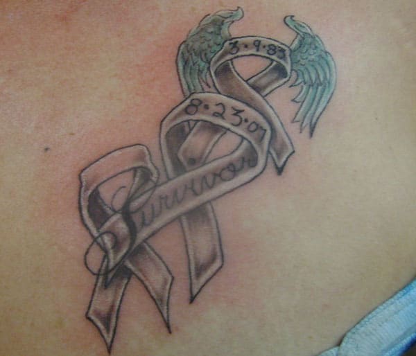 Cancer Ribbon tattoo on the upper chest brings the forlorn appearance