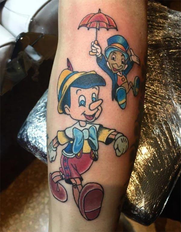 Disney Tattoo for men with blue ink design makes a man look cute