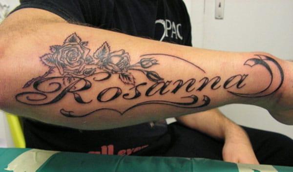 Forearm Tattoo with black ink flower and message make a man have a magnificent look