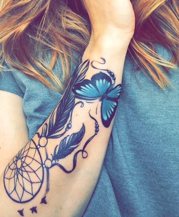 Forearm Tattoo with a blue butterfly ink design give her the fabulous gaze