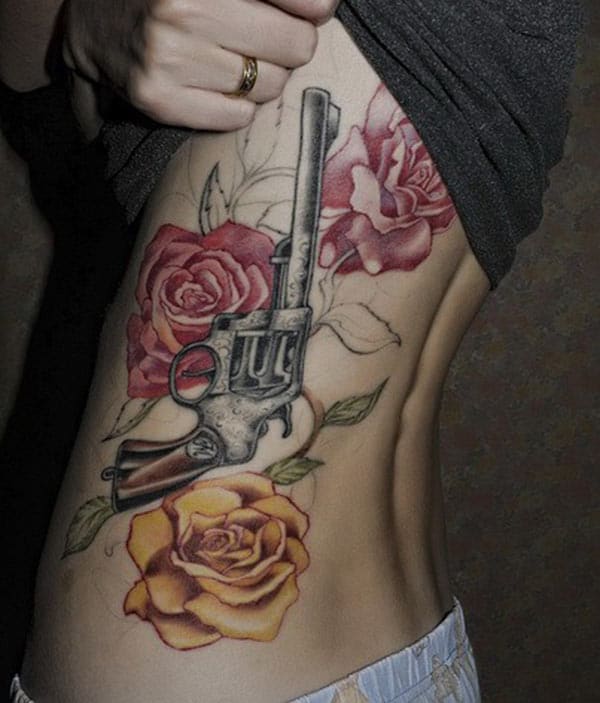 The Gun Tattoo design on their side belly will make the girls alluring and lovely