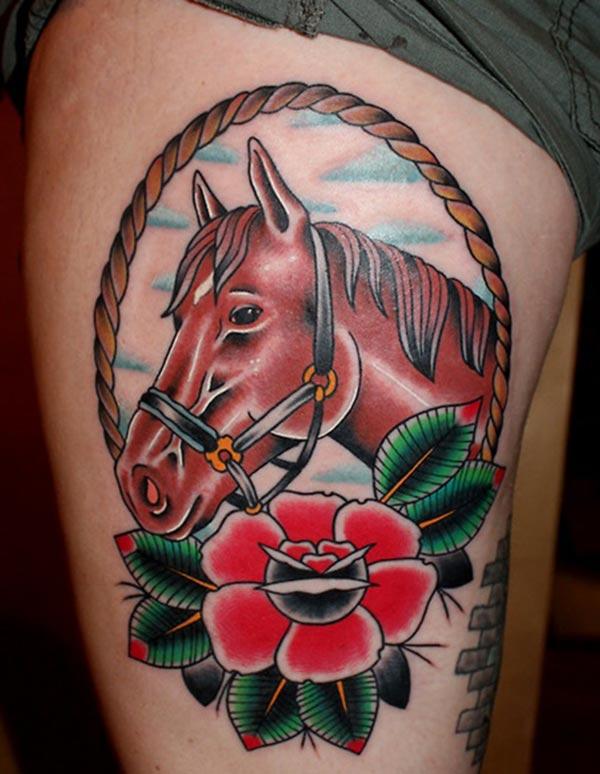 Horse tattoo with pink and green flower ink design makes a woman look attractive