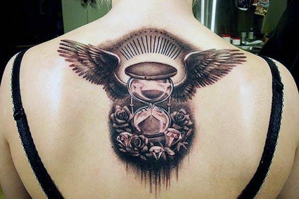 The Hourglass tattoo with a brown flower ink design makes girls have magnificent look