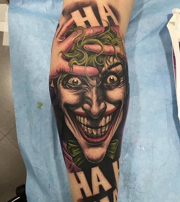 Joker Tattoo with a brown ink design on the lower arm shows their foxy look