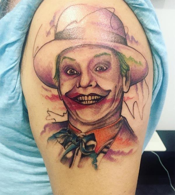 Joker Tattoo on the upper arm, make men look more attractive