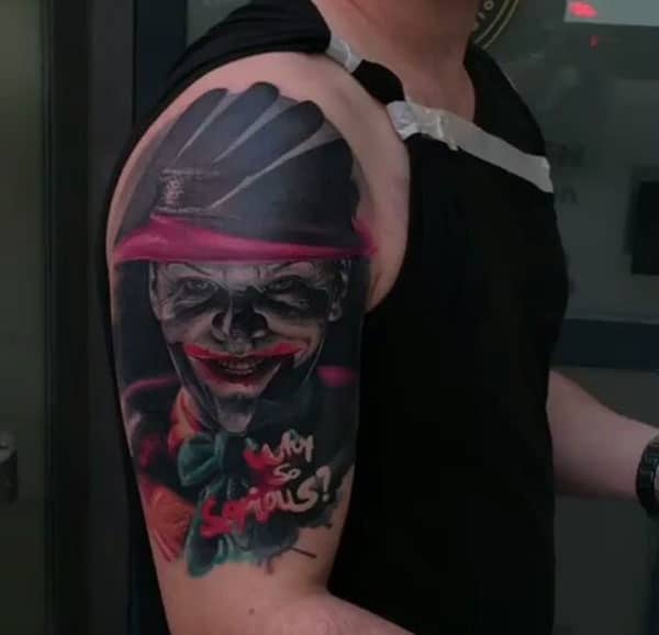 Joker Tattoo on the upper arm makes a man look cool