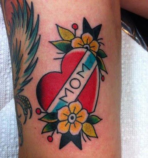 Mom Tattoo for men with a pink flower ink design makes them look marvelous