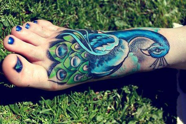 Makes a divine Peacock Tattoo on foot to flaunt it