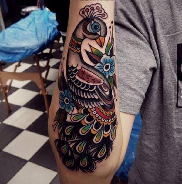 Peacock Tattoo on the lower arm shows their foxy look