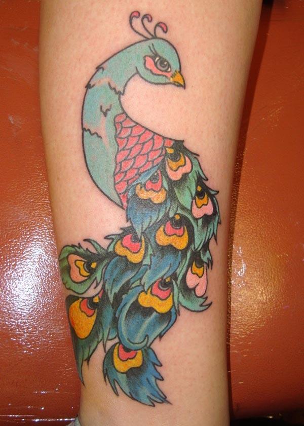 The Peacock Tattoo on the legs makes girls have Stunning look