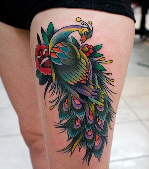 Peacock Tattoo for the upper thigh brings their feminist look.