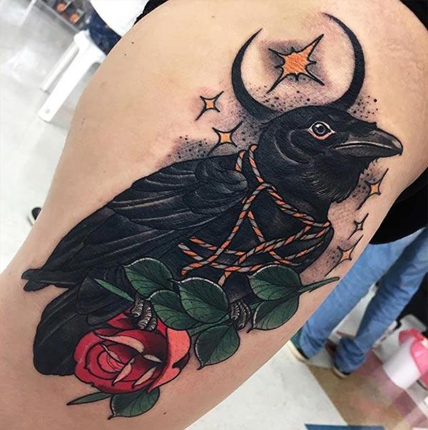Raven tattoo on the side thigh gives the girls look sexy and captivating 
