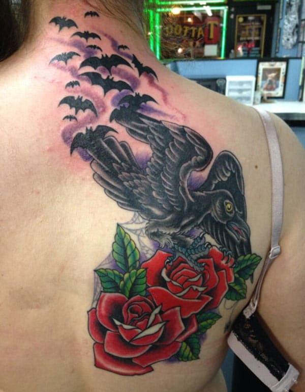 The Raven tattoo on the back shoulder with a pink ink design, make girls have splendid look 