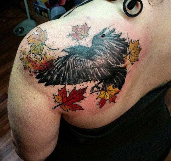 Raven tattoo on the back makes a girl look so cute