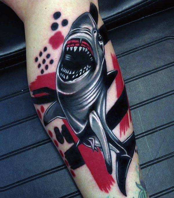 The Shark Tattoo on the bicep of a man make it look attractive