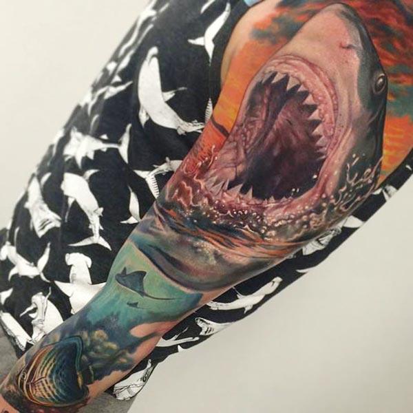 Men make a divine Shark Tattoo on their left shoulder to make them attractive