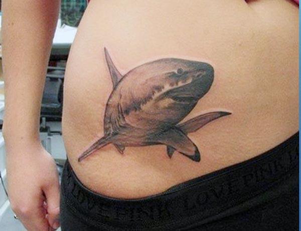 Shark Tattoo on the side waist in ladies brings out their gorgeous look