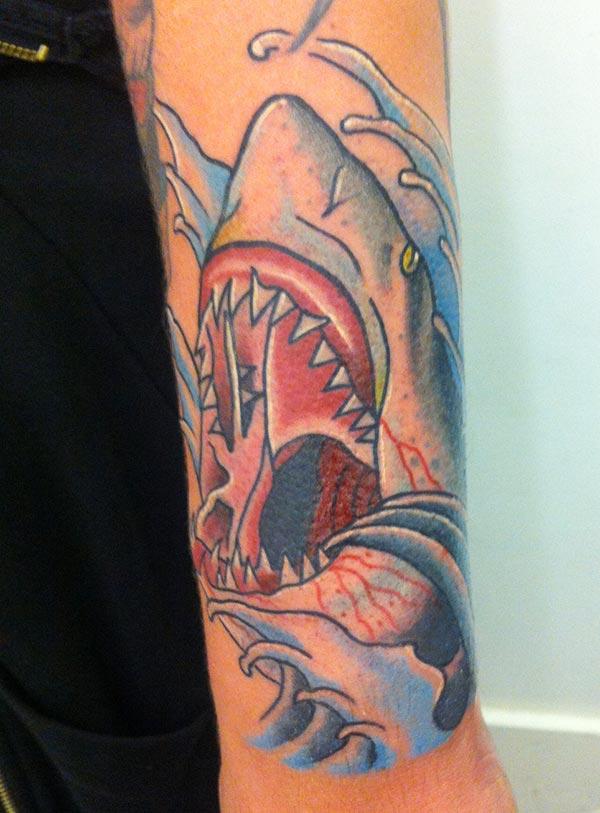 Shark Tattoo on the lower arm makes a man look cool