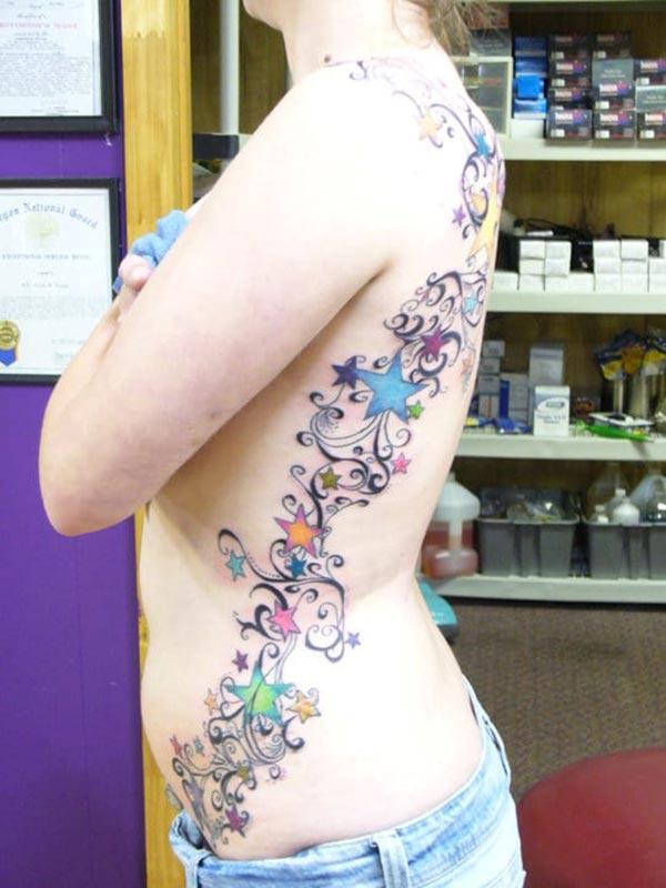 Side tattoo for Women with flower design making them look attractive 