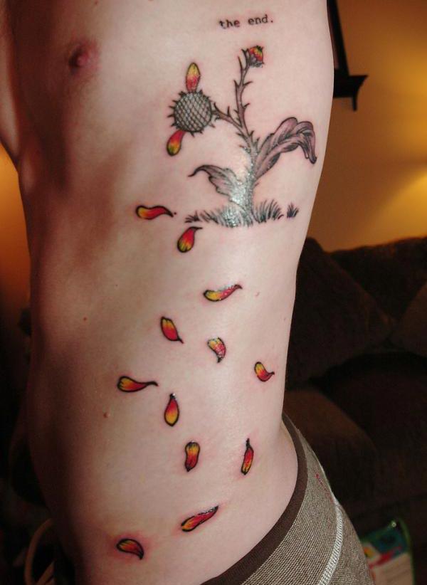 Side tattoo for men with the flower design makes them look attractive