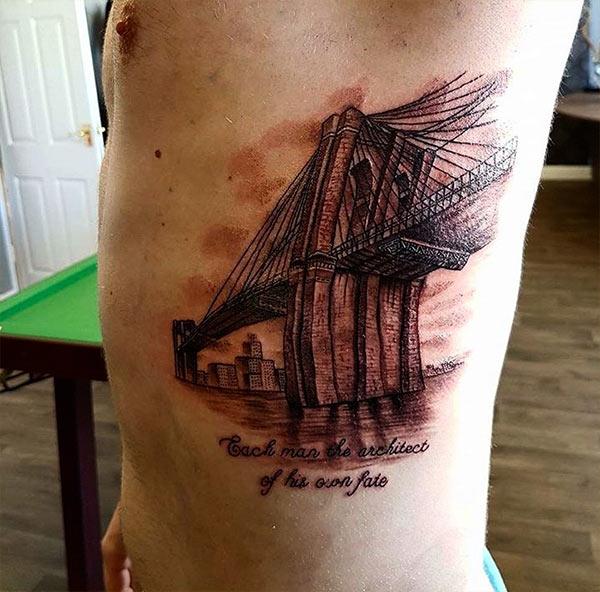 Side tattoo for men with building ink design makes a man look classy