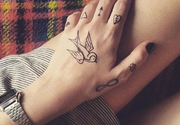 Sparrow tattoo on the hand with black ink mix make it more captivating