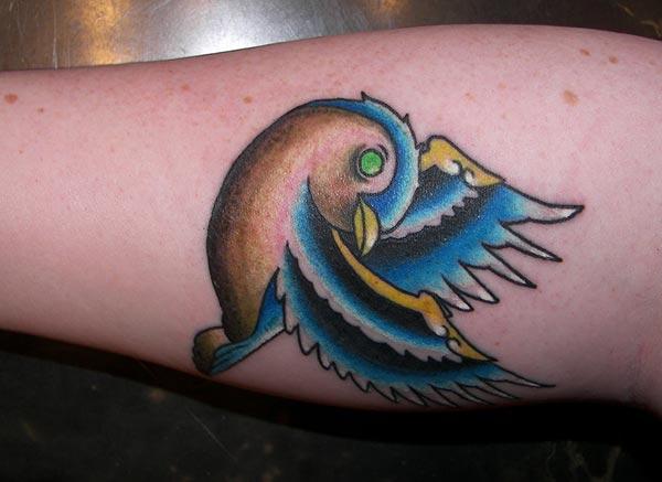 Sparrow tattoo with a blue ink design brings the astonishing look