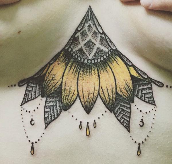Sternum tattoo for Women with yellow flower makes them look sexy and fabulous
