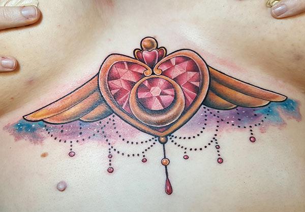 Sternum tattoo for Women with a pink ink design make them look sexy