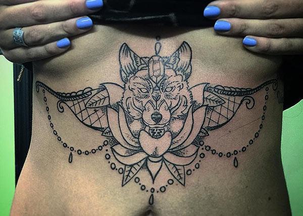 Sternum tattoo for Women with a fox drawing make them look sexy