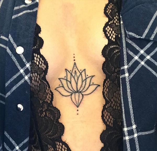 Sternum tattoo for Women with a black flower make them riveting