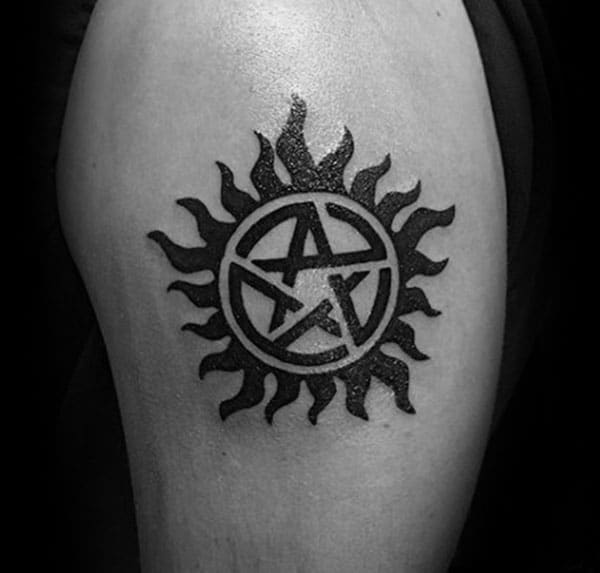 Supernatural Tattoo for men with the black ink design makes them look attractive