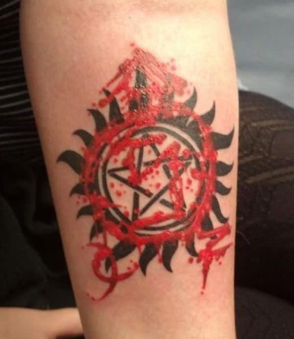 Supernatural tattoo on the lower arm brings the astonishing look
