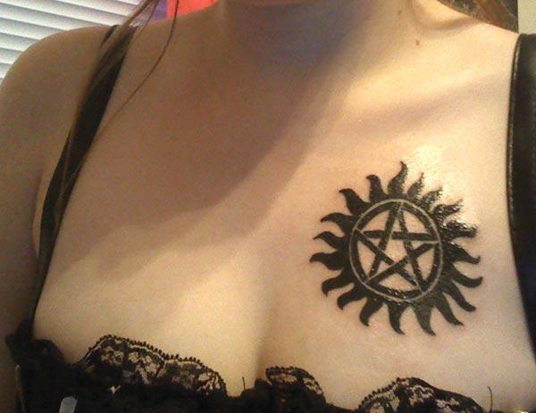 Supernatural tattoo on the upper chest brings a feminist look
