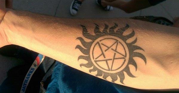 Supernatural tattoo on lower arm make a man look cool