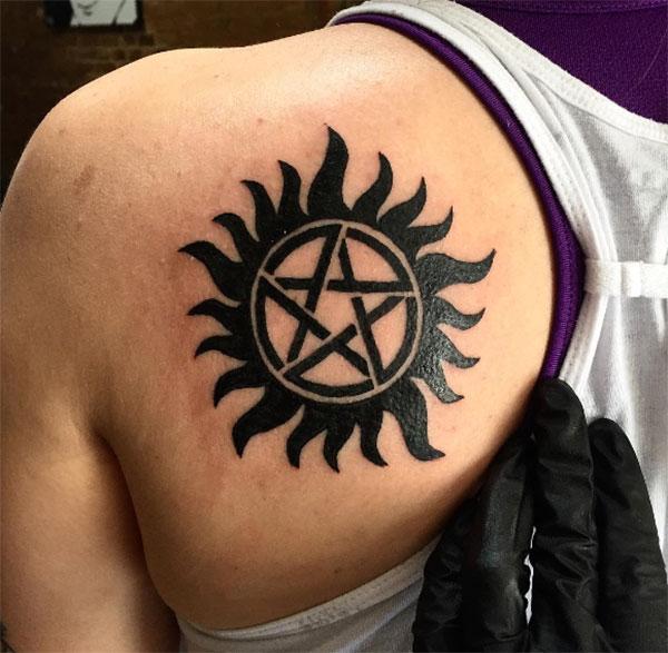 Supernatural tattoo on the back shoulder makes a girl alluring