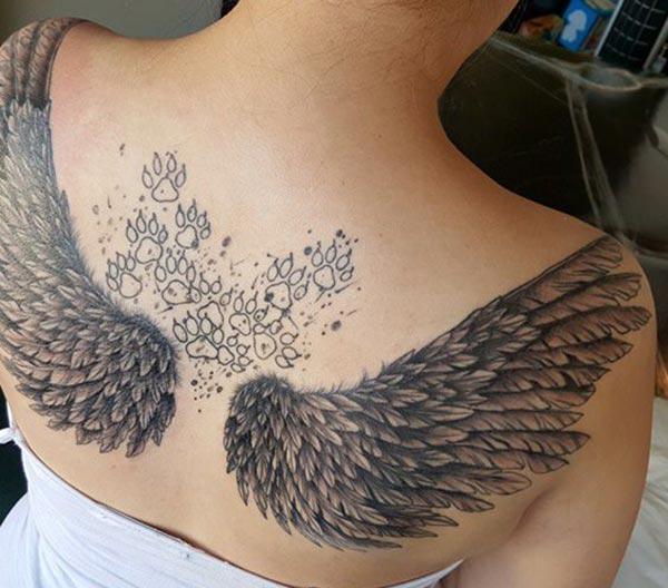 Wing Tattoo for Women on the back shoulder with a flower make them look sexy