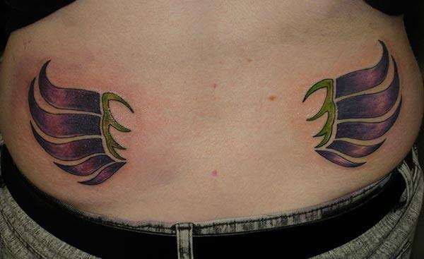 Wing Tattoo on the lower back brings the look cute